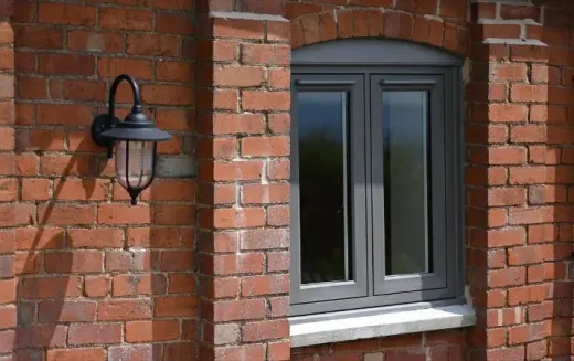 Grey Residence 9 window on a brick wall
